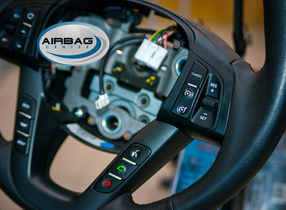 Airbag Center featured client — steering wheel airbag module location shown during repair